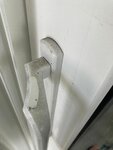 A resident of the Foxbrook community says her white door handles are covered in fine black dust each day because of the construction activities of a nearby development site. Photo by: Carolyn Alvarez